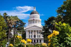 California State Capitol building, Sacramento, California; sunny day; beautiful yellow roses in the foreground
